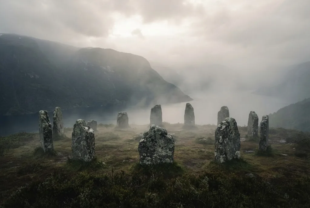 Artist's impression of a circle of old grey stones on a heather headland in mist, the fjord below